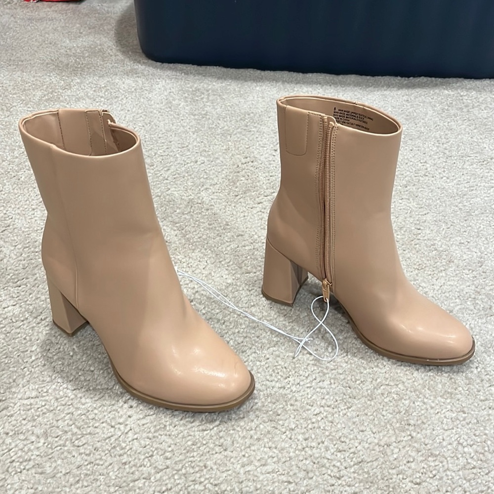 Tan booties with heel. Never worn